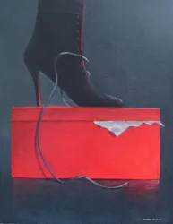 botte sur une boîte rouge