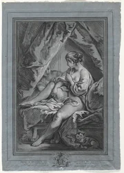 Jeune femme assise sur un lit
