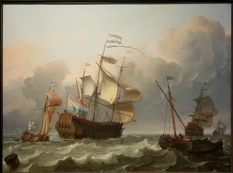 Un navire amiral néerlandais avec un yacht à son arrière
