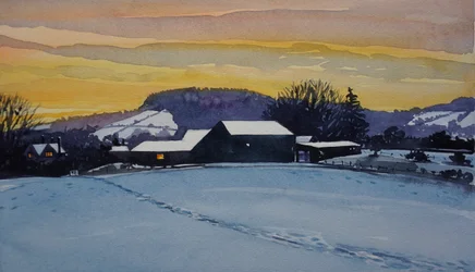 Coucher de soleil sur une ferme en hiver