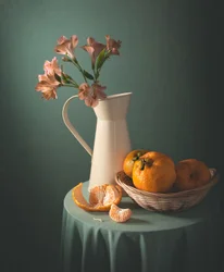 Mandarines et fleurs roses