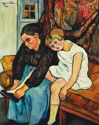 Grand-mère chaussant une fillette
