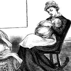 Une mère câlinant son enfant, assise sur une chaise berçante