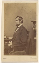 [Abraham Lincoln assis, de profil]