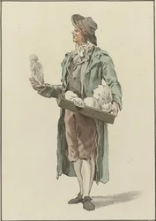 Marchand ambulant avec des statuettes en plâtre