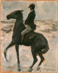 Cavalier vers la gauche sur la plage