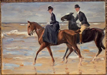 Cavalier et cavalière sur la plage