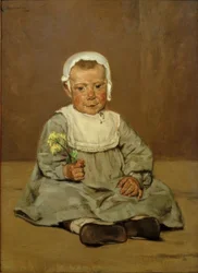 Enfant assis avec une fleur