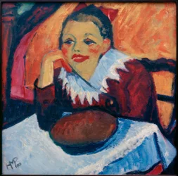 Fille rousse à table