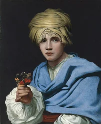Garçon en turban tenant un bouquet