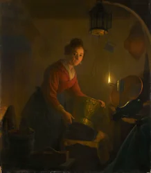 Une femme dans une cuisine à la lueur d