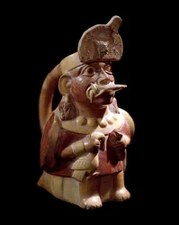 Art précolombien, civilisation mochica : vase anthropomorphe représentant un prêtre sacrifiant deux animaux. 200 av. J.-C.-700 apr. J.-C.