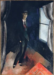 Homme devant la fenêtre