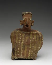 Figure féminine assise