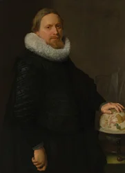 Homme avec un globe céleste