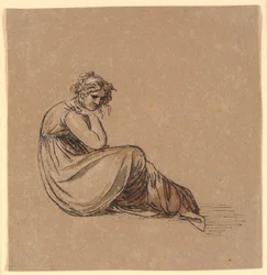 Femme assise avec le coude appuyé sur le genou droit