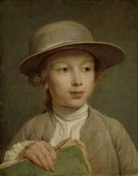 Garçon avec un livre de dessin
