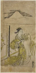 Femme tenant un kimono avec le mont Fuji au-dessus