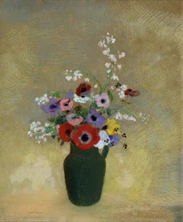 Grand vase vert avec des fleurs variées