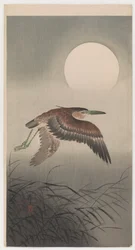 Héron volant et pleine lune