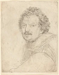 Un homme avec moustache et barbiche, de face