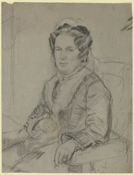 Femme âgée assise avec bonnet