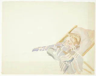 Jeune homme enveloppé dans un plaid, allongé dans une chaise longue