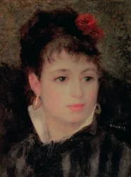 Femme avec une rose dans les cheveux
