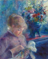 Jeune femme en train de coudre