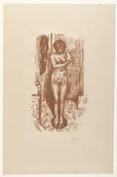 Femme nue assise se lavant