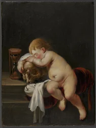 Garçon dormant sur un crâne