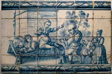 Le médecin administrant un lavement à un patient - Panneau satirique de Lisbonne, première moitié du XVIIIe siècle (Médecin - Panneau satirique, première moitié du XVIIIe siècle) - Musée national des azulejos, Lisbonne (Portugal)