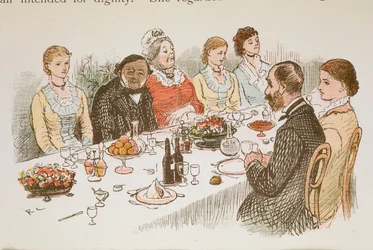 Des personnes assises à une table à manger.