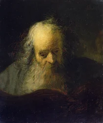 Un vieil homme lisant un livre