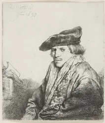 Jeune homme avec un bonnet de velours et des livres à côté de lui