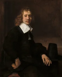 Un jeune homme assis à une table (peut-être Govaert Flinck)
