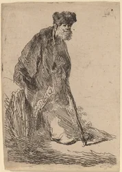 Homme en manteau et bonnet de fourrure appuyé contre une berge