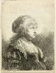 Saskia avec des perles dans les cheveux
