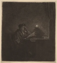 Étudiant à une table à la lumière des bougies