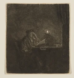 Un étudiant à une table à la lueur d