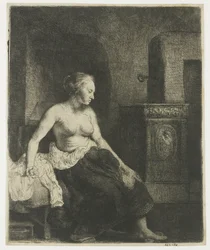 Femme assise à moitié habillée près d