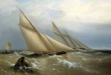 Un schooner et un yacht de coupe contournant une bouée
