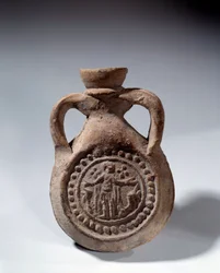 Art romain : ampoule en terre cuite avec pied représentant un saint