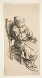 Vieil homme dormant dans un fauteuil