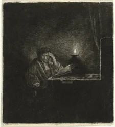Étudiant à une table à la lumière d