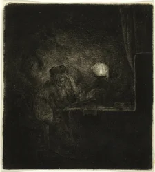 Étudiant à une table à la lumière d
