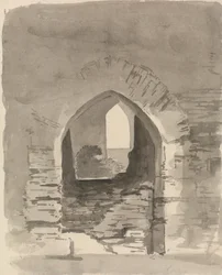 Une entrée voûtée dans un bâtiment en ruine