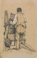 Un ouvrier vu de dos opérant une machine