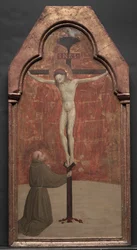 Saint François agenouillé devant le Christ sur la croix