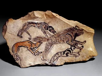 Chiens chassant la hyène (gravure sur pierre, vers 1300-1100 av. J.-C.)